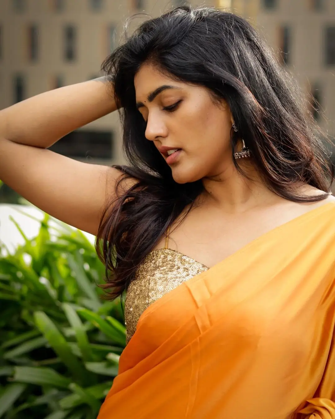 Eesha Rebba Charming Stills In Orange Saree Sleeveless Blouse